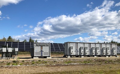 The recently commissioned 2.45MW battery storage system built by ENGIE North America in Moultonborough which will store power for use at peak times. The steel housings that contain the batteries are seen alongside and existing solar farm on the site.