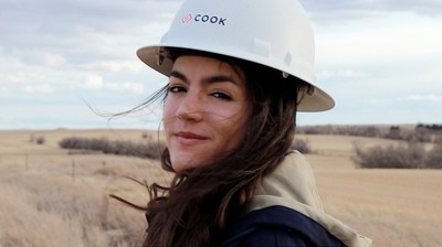Action shot of Alma Cook working in the North Dakota oilfield in the "5000 Candles" music video