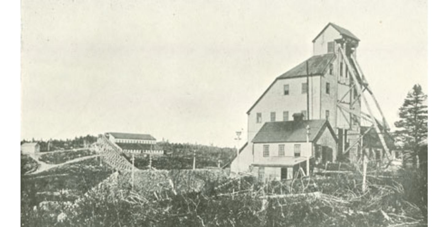 A large white building with a steep roof
Description automatically generated with medium confidence