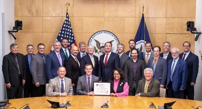 Representatives from Natura Resources, the Zachry Group, Abilene Christian University, The University of Texas at Austin, Texas A&M University, and the Georgia Institute of Technology receive the issued Construction Permit at the Nuclear Regulatory Commission. (Image credit – Natura Resources LLC)