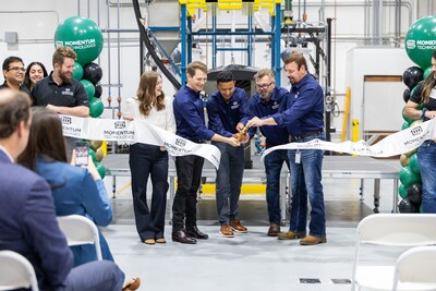 Mahesh Konduru and the Momentum Technologies leadership team cut the ribbon at the grand opening of the new Carrollton R&D facility.