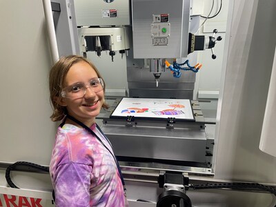 A camper gets an introduction to 3-D printing at Lakeshore College in Cleveland, Wis.