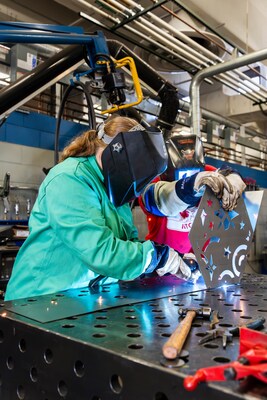 Campers weld some sheet metal at Northcentral Technical College in Wausau, Wis.