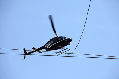 FirstEnergy's aerial inspections are performed at low-flying patrol speeds between 25 and 35 mph, using an infrared and ultraviolet camera mounted on the bottom of the helicopter. The onboard thermographer uses the camera to view the electrical equipment through infrared and ultraviolet spectrums to identify any sources of overheated components or voltage issues.