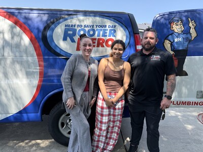 Rooter Hero's Mother's Day contest winner Christel Sheppard, left, and her daughter, Amaiyah, pose with Rooter Hero of Sacramento General Manager Adam Owens while his team installed her new water heater.