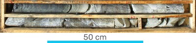 Figure 4. General aspect of the Los Mangos vein in hole DH469, showing a quartz-supported breccia with massive pyrite-marcasite bands (yellow metallic luster) with argentite (blackish bands) and coarse-grained sphalerite (reddish brown). Hole DH469 depths from 209.39 to 211.15 metres. (CNW Group/Outcrop Silver & Gold Corporation)