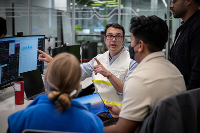 SDGE employees coordinate closely during a training drill inside the Emergency Operations Center, demonstrating teamwork and readiness in emergency response scenarios.