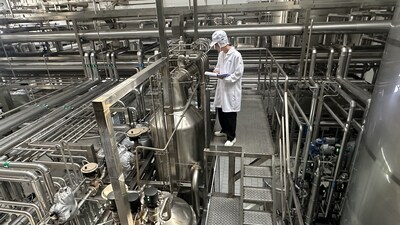 A Junlebao team member reviews the nearly completed APV InfusionPlus system—custom-built in China to help scale Freshjoy milk production.