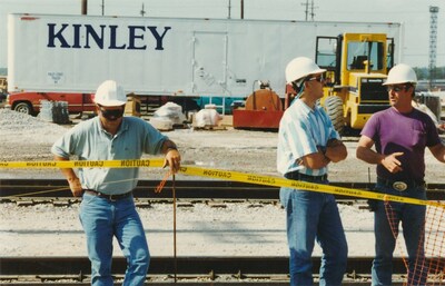 John and Angelo Crisafulli, part of the fifth-generation Kinley leadership team, with 50+ year Kinley veteran Don Wilcox on a railroad job site in the 1990s.