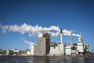 Saint John pulp and paper mill in front of a body of water with a blue skyline in the background. (CNW Group/Canada Infrastructure Bank)