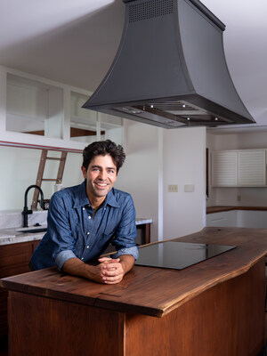 Adrian Grenier under his new CopperSmith® range hood