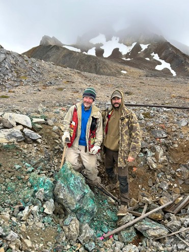 Geologists Len Gal and Michael Garagan standing with exposed copper mineralization on the surface at the Three Guardsmen Project in Northern BC