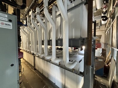 Central thermal storage system: 24 pairs of Thermino units working together to deliver scalable, efficient hot water and peak demand management for a large building.