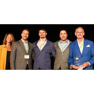 Al Cheswick, KrellTech president, and his team accept "Innovator of the Year Award."