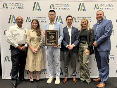 Joey Qiao (center, holding award) and Ryan Compton (to his right)