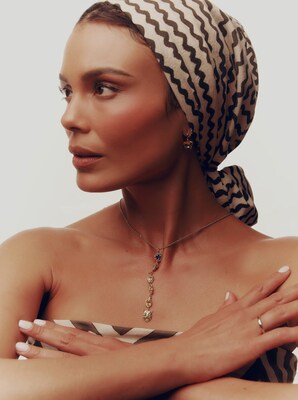 Actress and activist, Nathalie Kelley, modeling jewelry by Andrea Jose (Necklace); Brilliant Earth (Ring); Christina Malle Jewelry (Earrings); Dana Bronfman (Earrings)