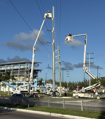 BGC crews installing one of 193 new transmission poles, all rated to withstand Category 5 hurricanes.