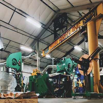 Interior of the Micro Forms manufacturing facility in Garland, Texas, showing precision metal stamping presses and production equipment used to manufacture tight-tolerance components with custom tooling. Interior of the Micro Forms manufacturing facility in Garland, Texas, showing precision metal stamping presses and production equipment used to manufacture tight-tolerance components with custom tooling.