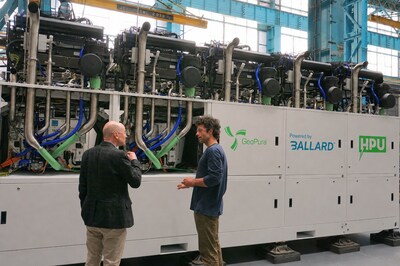 GeoPura CEO Andrew Cunningham (left) and CTO Theo Elmer (right) in front of an HPU-2 500kW system containing Ballard Fuel Cell Engines. (CNW Group/Ballard Power Systems Inc.)