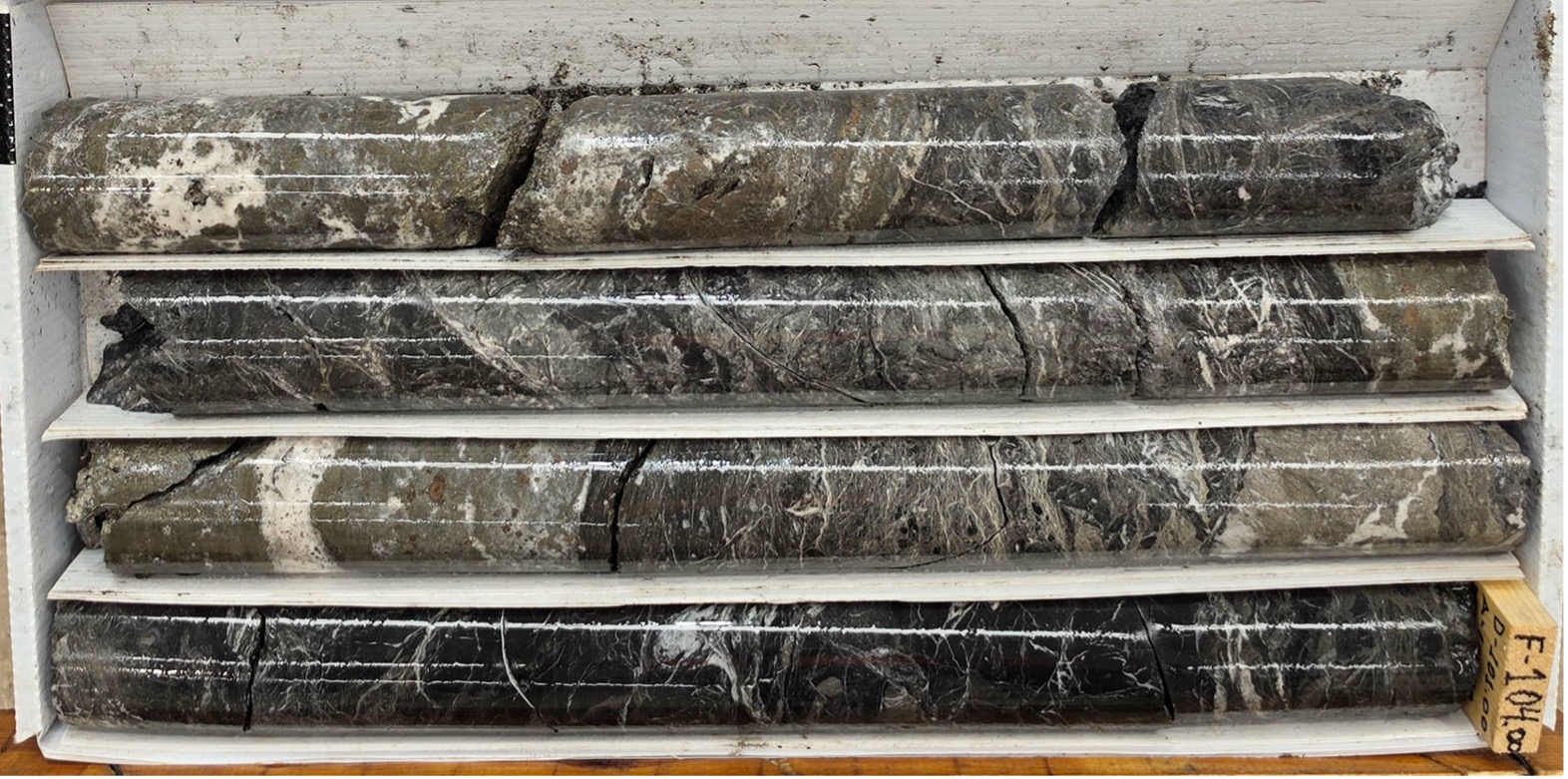Multiphase quartz-carbonate vein with abundant banded and clotted pyrite-sphalerite-galena. Hole CRI-2026-30: 101.85 to 104.00.